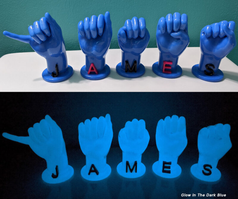 Letters "JAMES" in glow in the dark blue with black and magenta letters