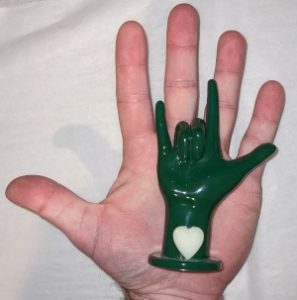 small ILU hand on top of hand showing size